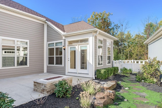 view of exterior entry featuring a patio