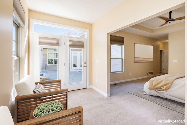 bedroom featuring light colored carpet, ceiling fan, and crown molding