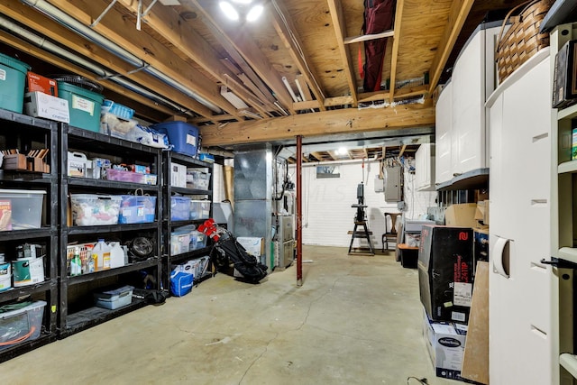 basement with electric panel and heating unit