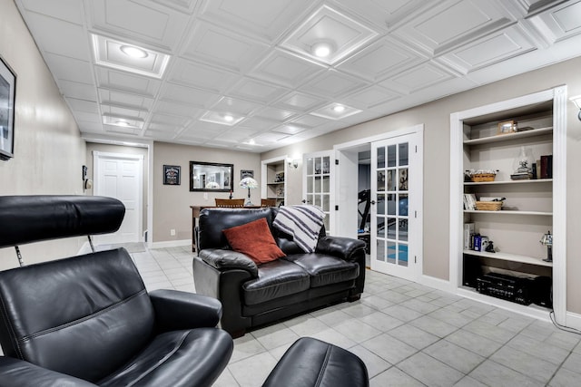 living room with built in shelves, light tile patterned flooring, and french doors