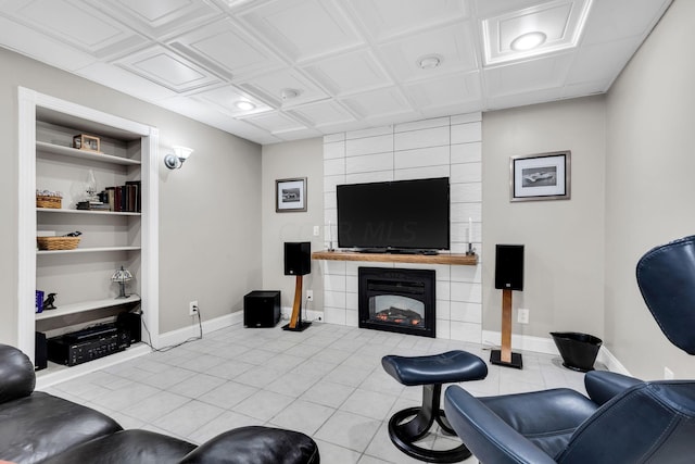 tiled living room with built in shelves and a tiled fireplace