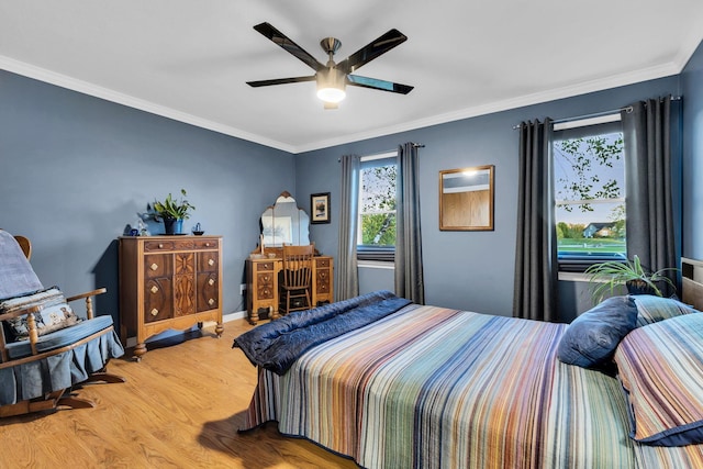 bedroom with wood-type flooring, ceiling fan, and ornamental molding