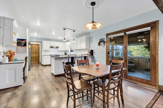 dining area featuring hardwood / wood-style floors