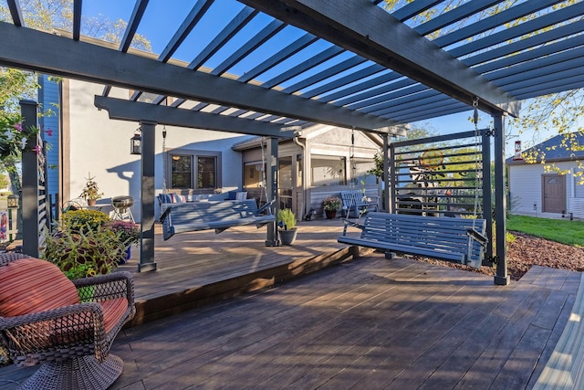 deck featuring a pergola and outdoor lounge area