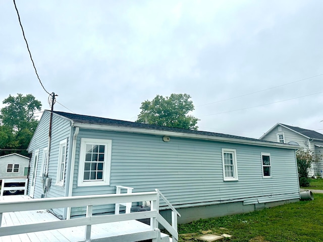 view of home's exterior featuring a deck