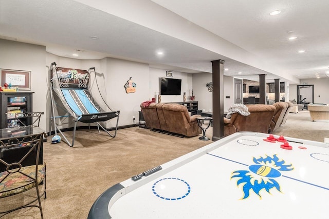 playroom featuring carpet floors and a textured ceiling