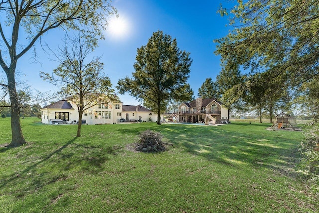 view of yard featuring a wooden deck