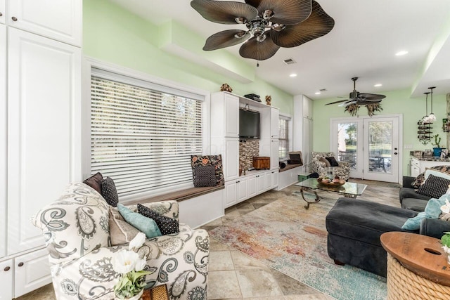 living room with french doors and light tile patterned floors