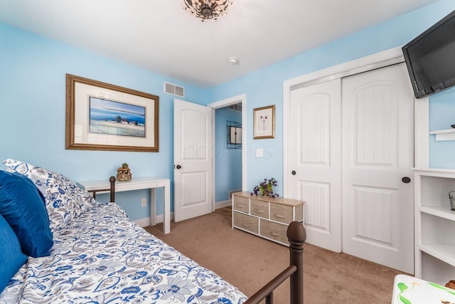 carpeted bedroom with a closet