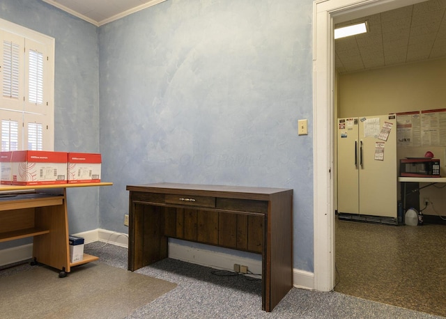 carpeted office featuring crown molding