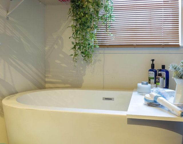 bathroom with a tub to relax in