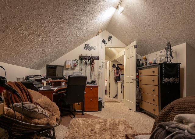 home office with light carpet, a textured ceiling, and vaulted ceiling