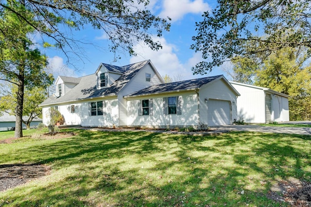 view of front of house with a garage and a front lawn