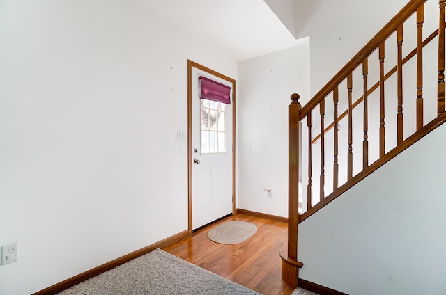 foyer entrance with hardwood / wood-style floors