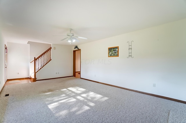 carpeted empty room with ceiling fan