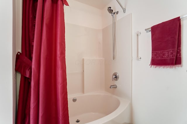 bathroom featuring shower / bathtub combination with curtain