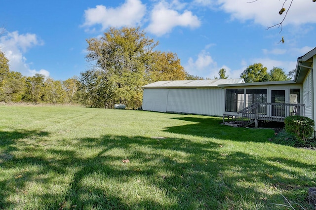 view of yard with a sunroom