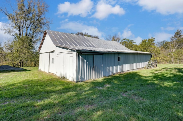 view of outbuilding featuring a lawn