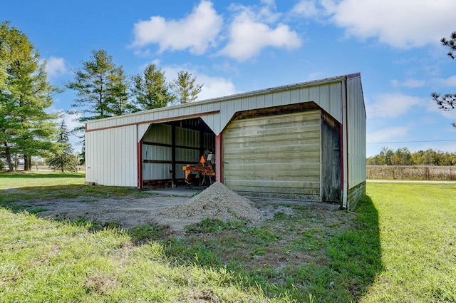 view of outbuilding featuring a lawn