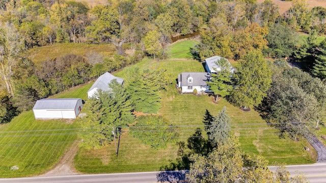 birds eye view of property with a rural view