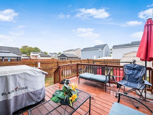 wooden terrace featuring area for grilling