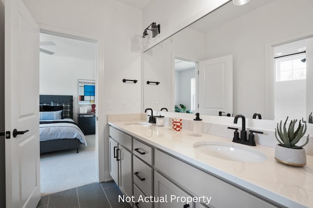 bathroom featuring tile patterned flooring and vanity