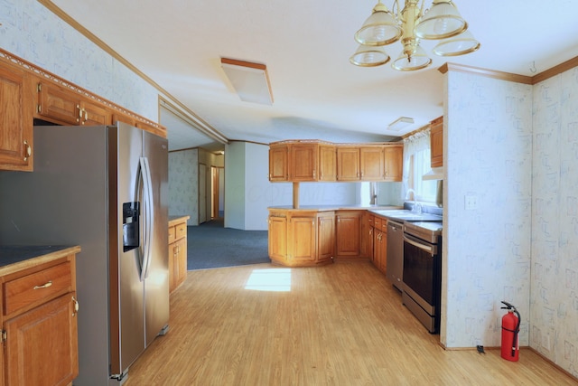 kitchen with sink, light hardwood / wood-style flooring, a notable chandelier, crown molding, and appliances with stainless steel finishes