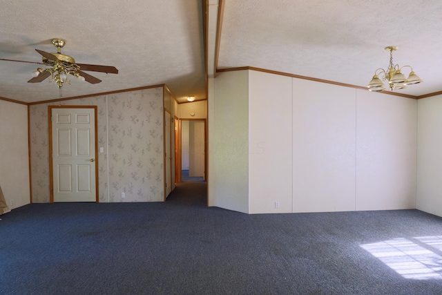 spare room with carpet flooring, ornamental molding, a textured ceiling, ceiling fan with notable chandelier, and vaulted ceiling