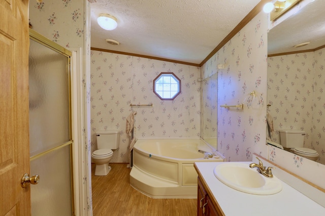 full bathroom with hardwood / wood-style floors, vaulted ceiling, toilet, ornamental molding, and a textured ceiling