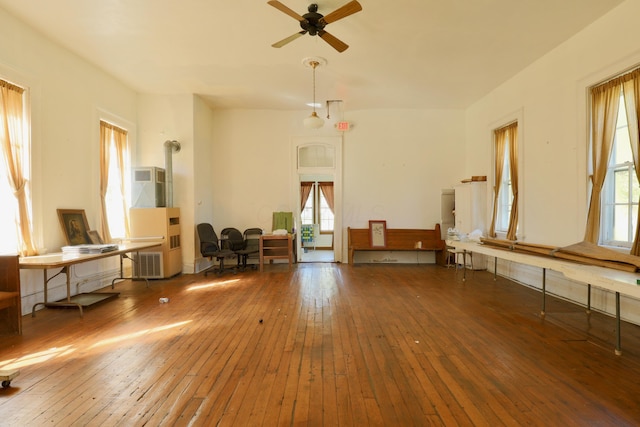 miscellaneous room with ceiling fan and dark wood-type flooring