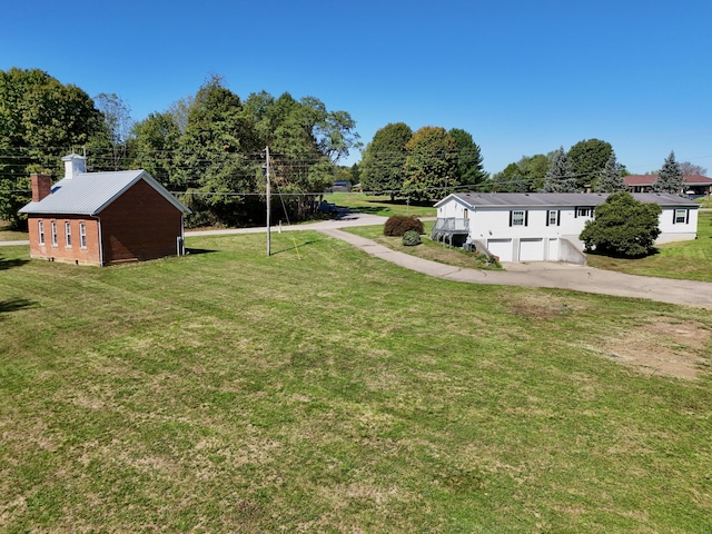 view of yard featuring a garage