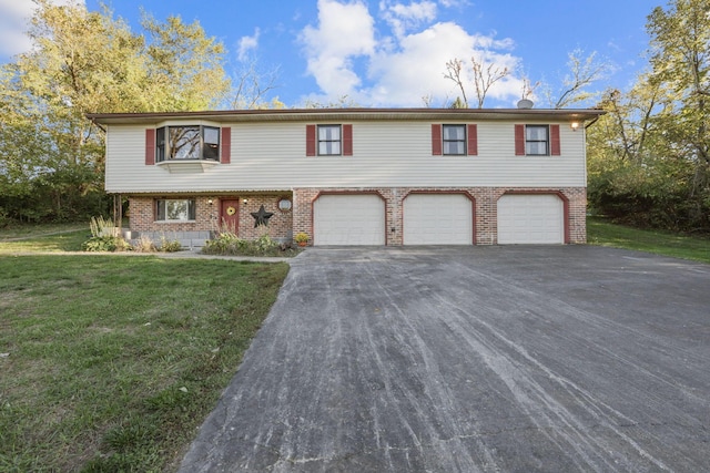 view of front facade with a front yard and a garage