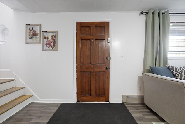 entrance foyer with baseboard heating and dark hardwood / wood-style floors