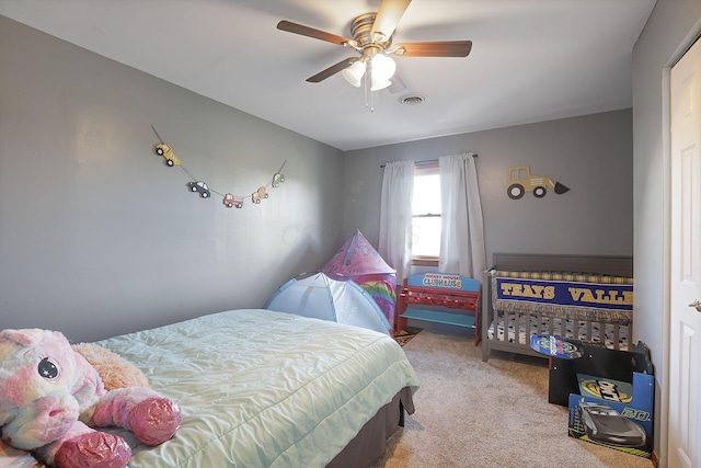 bedroom featuring ceiling fan and light colored carpet