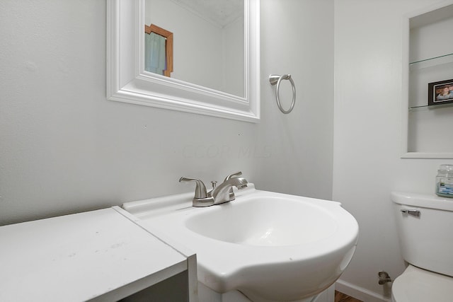 bathroom with vanity and toilet