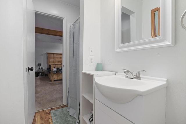 bathroom with vanity and hardwood / wood-style flooring