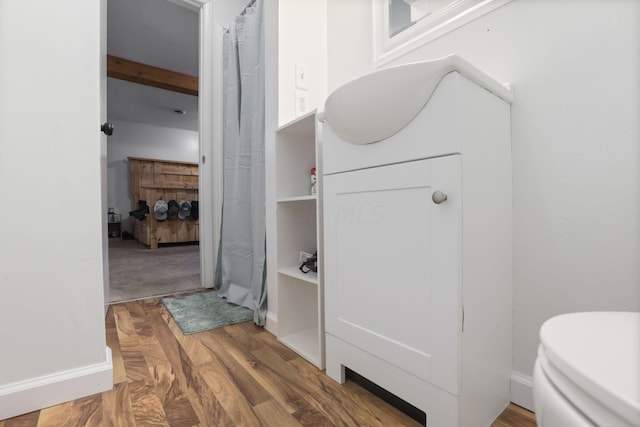 bathroom with wood-type flooring