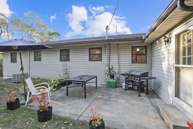 view of patio with cooling unit and area for grilling