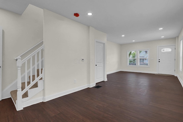 entrance foyer featuring dark hardwood / wood-style floors