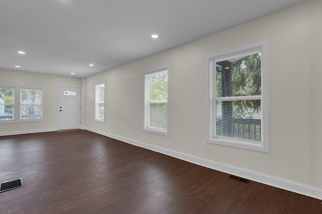 interior space with dark hardwood / wood-style flooring