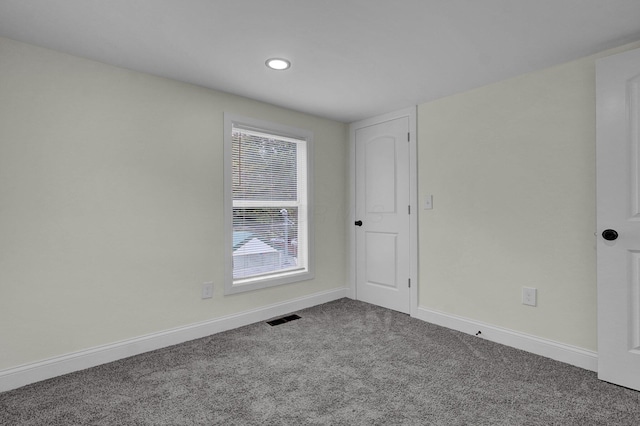 empty room with carpet flooring