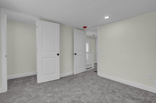 unfurnished bedroom featuring carpet flooring