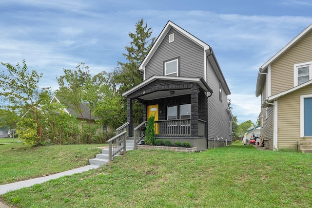 view of front of property with a porch and a front lawn