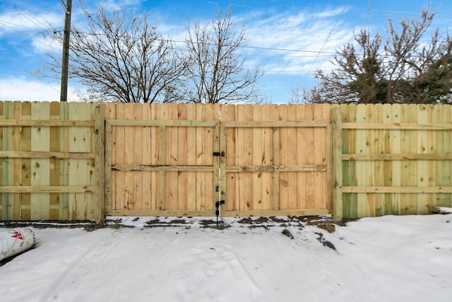 view of snow covered gate