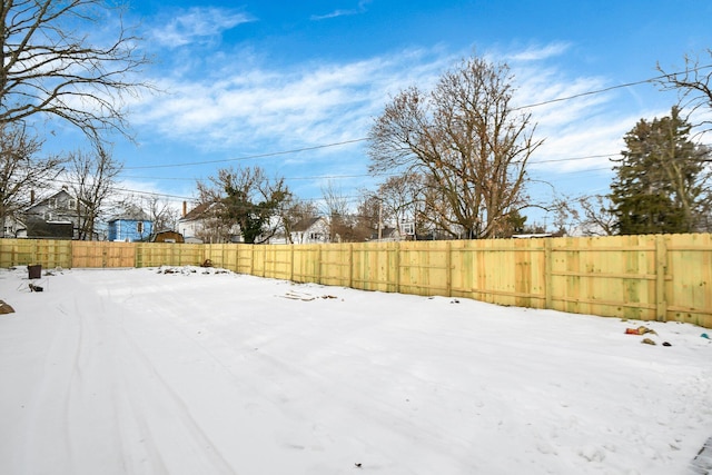 view of yard covered in snow