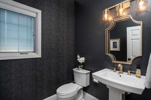 bathroom with sink and toilet