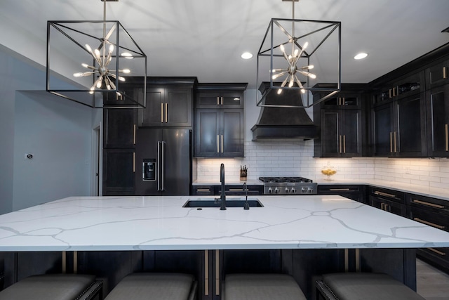 kitchen featuring a kitchen breakfast bar, tasteful backsplash, sink, and stainless steel appliances