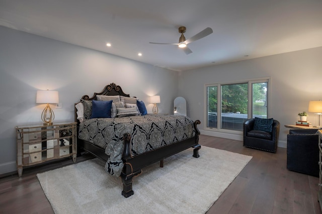 bedroom featuring ceiling fan and dark wood-type flooring