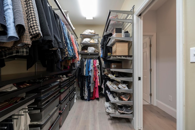 walk in closet featuring hardwood / wood-style floors