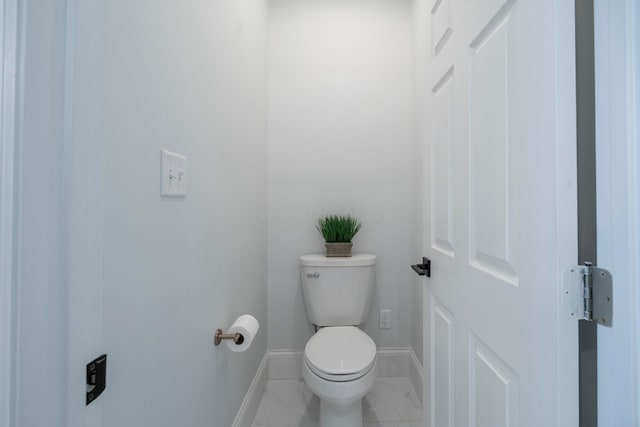 bathroom featuring toilet